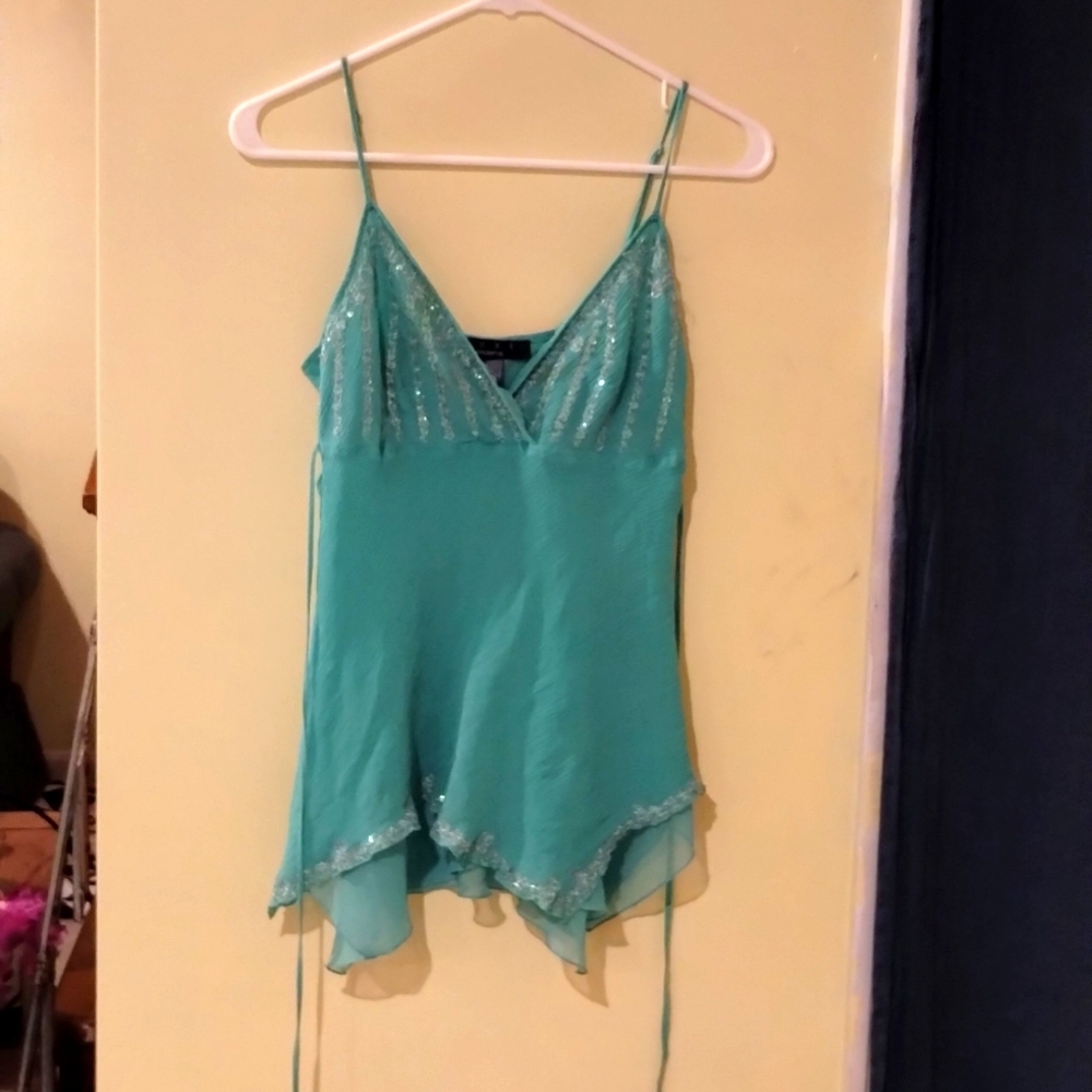 A turquoise LUXE tank top.